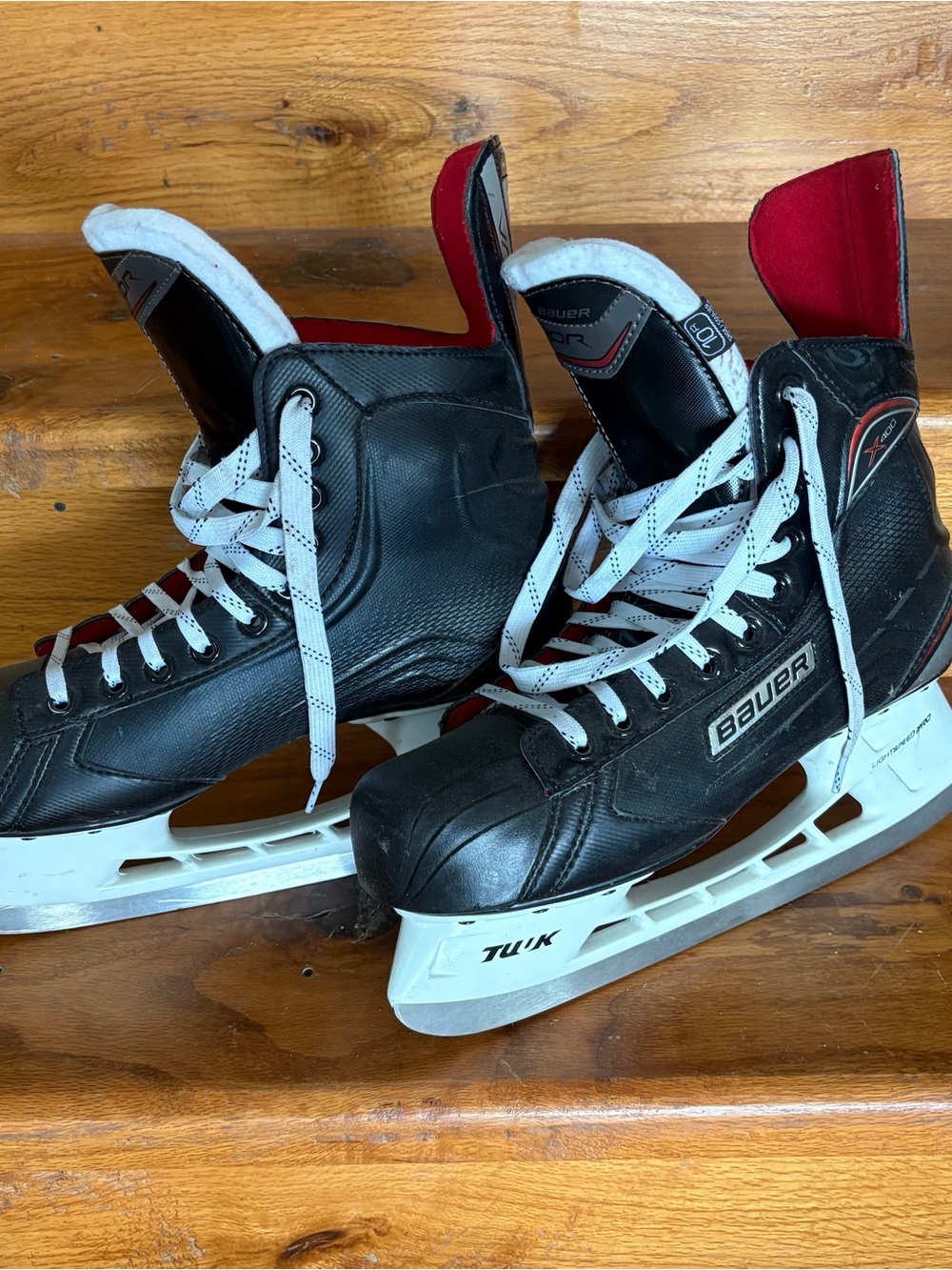 Bauer Black and White Hockey Skates with Red Tongue Accents